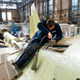 Illustration for article titled These Riveting Photos Show How Russias Su-34 Fullback Fighter-Bombers Get Built